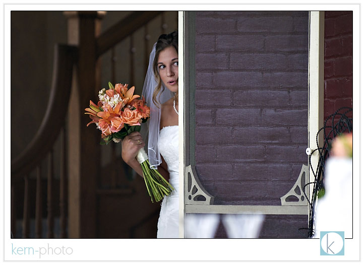 nerves on the mind, shara peers out the porch door of the mccreery house just before the ceremony.