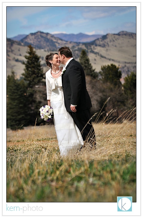 wedding with boulder flatirons in background by kern photo